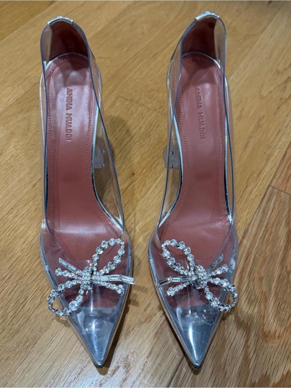 Amina Muaddi Clear PVC Pointed Toe Pumps with Crystal Bow